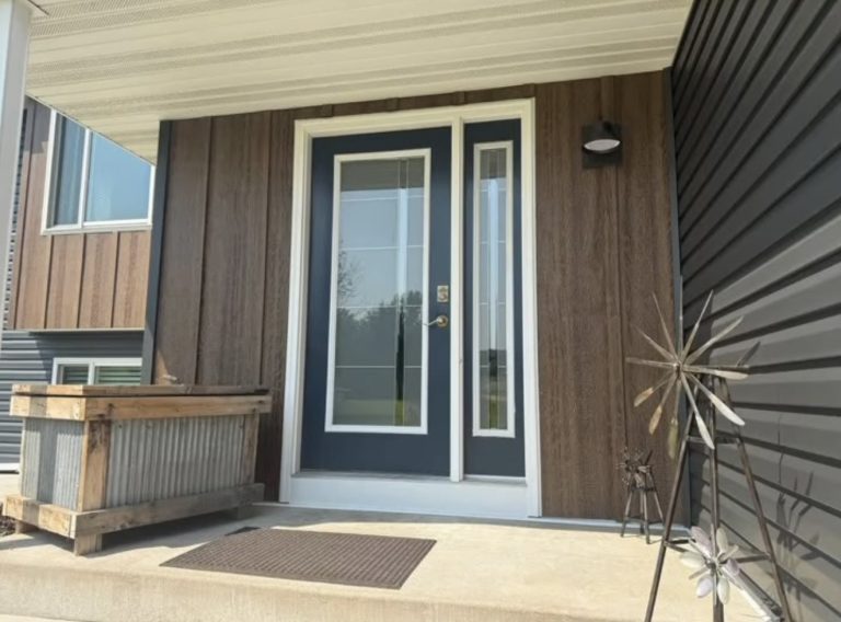 Board and batten siding with modern entry door installation — Becker Roofing WI