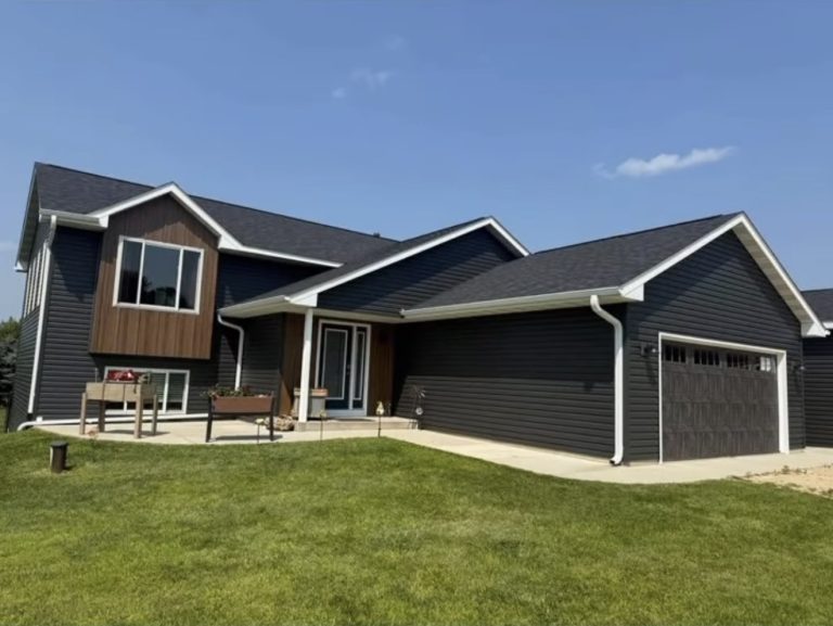 Complete exterior transformation dark siding and gutters — Becker Roofing WI