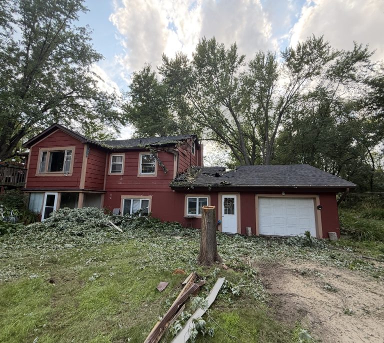 Storm damage repair — tree through roof — Becker Roofing New Richmond WI